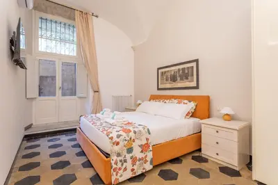 a bedroom with a bed and a window at Prati 3BDR Urban Charm in Rome