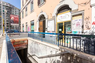 a bridge over a street in a city at Casa Miso in Rome