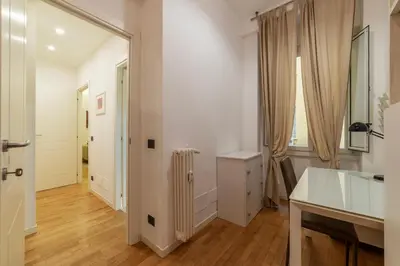 a white room with a radiator and a window at GuestHost - Piazza Bologna Sweet Apartment in Rome
