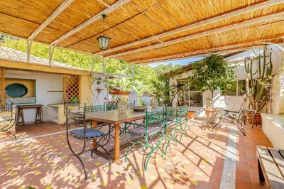 an outdoor patio with a table and chairs at Riad Riari in Rome