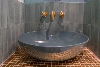 a shower head in a bathroom with a shower at PgrHome Colosseo 11 BLU in Rome