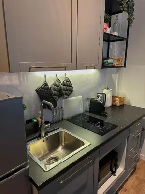 a kitchen with a sink and a stove at Santo Apartment in Trastevere in Rome
