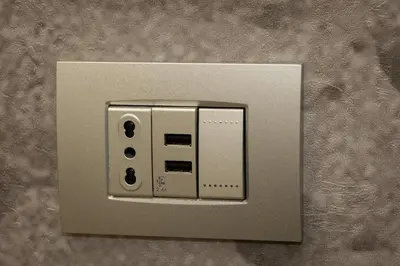 a light switch on a wall at San Pietro Guest House in Rome