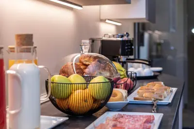 a counter with a bunch of bread and a plate of food at Trastevere 143 in Rome