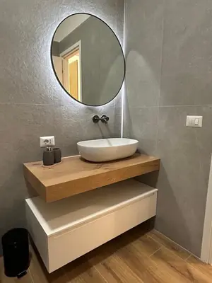 a bathroom with a sink and a mirror at SIRI VATICAN LOFT - Design House Rome in Rome