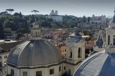 a view of a city from the roofs of buildings at Piazza di Spagna Home - Family Apartment in Rome