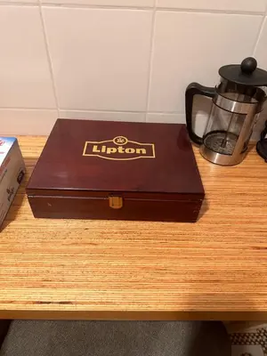 a brown box sitting on top of a wooden table at Welcome to Pantheon in Rome