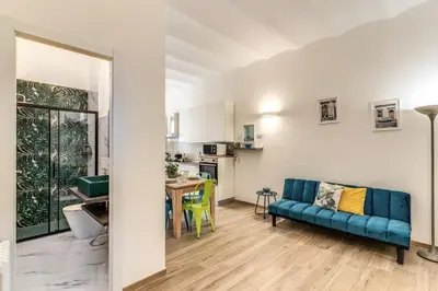 a bedroom with a bed and a palm mural on the wall at Nala Luxury Apartment with terrace in Rome