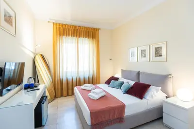 a bedroom with a bed and a television in it at TimeRoma Vatican in Rome