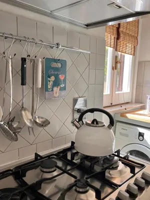 a tea kettle on top of a stove in a kitchen at Casa Fiore in Rome