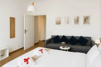 a living room with a bed and a couch at Flaminio Luxury - GR HOME in Rome