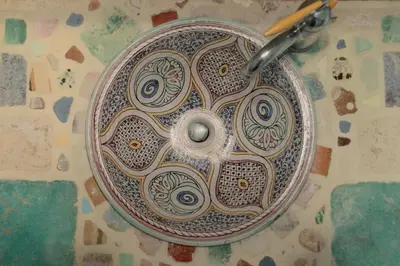 a bathroom sink with a drain in it at Minerva House in Rome