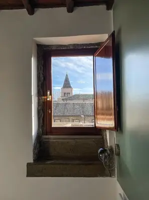 a view of a church from a window in a building at DomusLu' - Casa di charme nel cuore di Roma in Rome