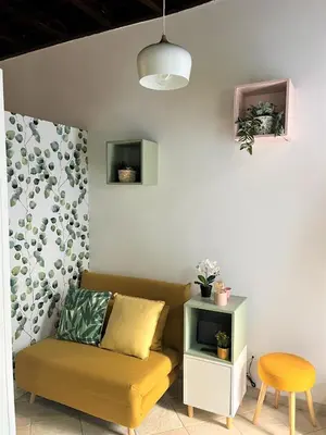 a living room with a couch and a table at Nest to Colosseum in Rome