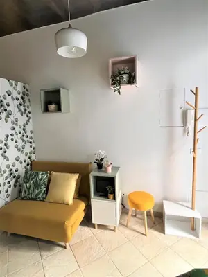 a living room with a couch and a table at Nest to Colosseum in Rome