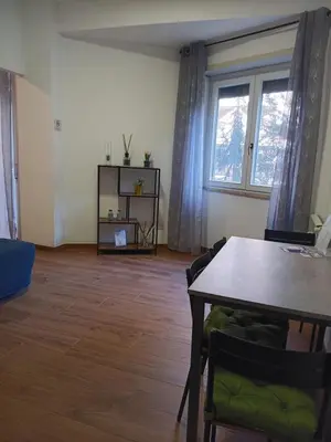 a kitchen with a washing machine and a microwave at SAN PAOLO ROMA HOLIDAY HOME in Rome
