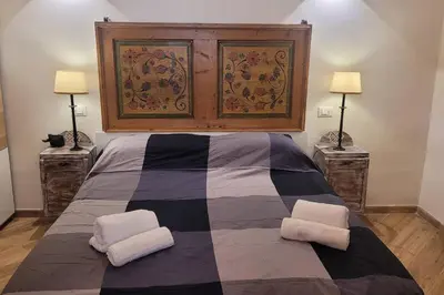a bedroom with a large bed with two pillows at casa vacanza vaticano in Rome
