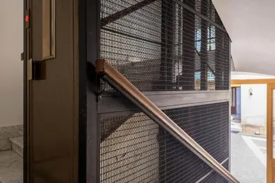 a door with a cage with a baseball bat at The Best Rent - Bright flat near San Pietro in Rome