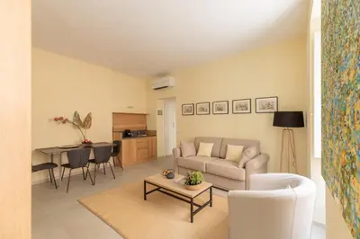 a living room with a couch and a table at iFlat Lovely in Trevi in Rome