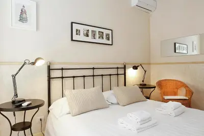 a bedroom with a bed with two white towels on it at Apartment Felice in Rome