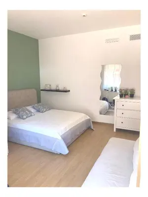 a bedroom with two beds and a mirror at Terrace! in Rome