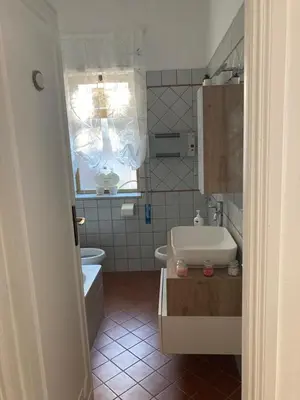a bathroom with a sink and a tub and a toilet at Terrace! in Rome