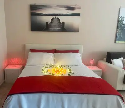 a bedroom with a bed with flowers on it at Rome Maya Home in Rome