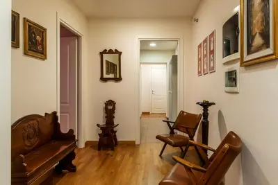 a living room with two chairs and a couch at GuestHost - Roma Termini Comfy Apartment in Rome