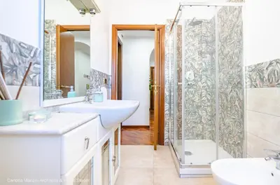 a bathroom with two sinks and a shower at La Casa di Azzurra in Rome
