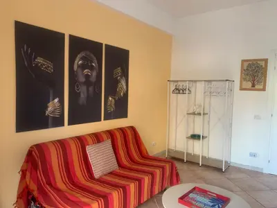 a living room with a couch and a table at CHEZ NOUS in Rome