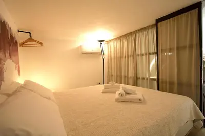 a hotel room with a bed with towels on it at Monti Holiday House in Rome