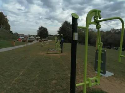 a playground with green poles in a park at TEMPORARY HOME ROMA in Rome