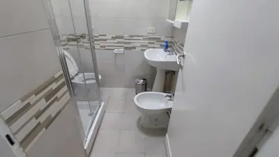 a small bathroom with a toilet and a sink at VATICAN GREEN GARDEN in Rome