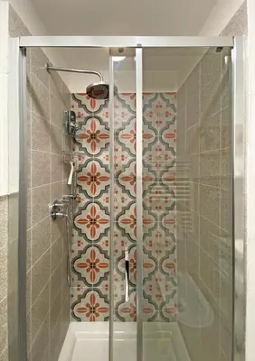 a shower with a glass door in a bathroom at Cortile al Vaticano by Bed&Bros in Rome