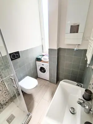 a small bathroom with a toilet and a sink at Il Cortile - Appartamento nel cuore di Testaccio in Rome