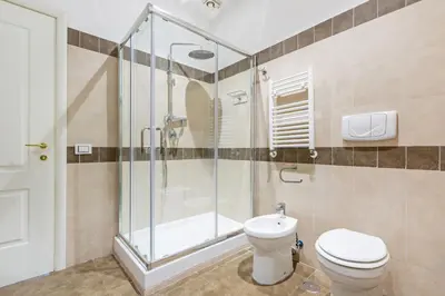 a bathroom with a shower and a toilet at 15 Minuti a Piedi dai Musei Vaticani in Rome