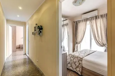 a bedroom with a bed and a large window at Rdd in Rome
