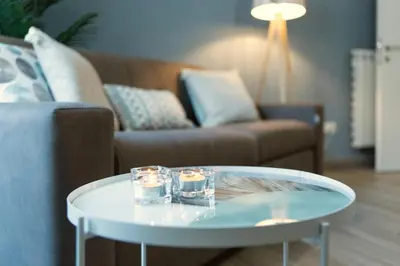 a living room with a coffee table and a couch at Etta Suite - Close Vatican Museum in Rome
