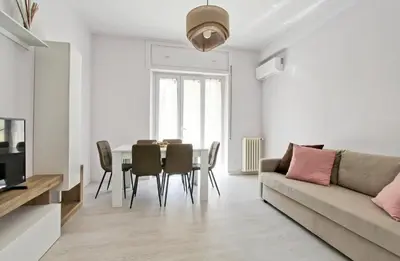 a living room with a table and a couch at Martina Garden in Rome