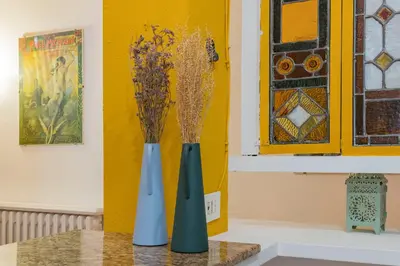 two blue vases sitting on top of a table at Colosseum Flat - ZEN23 in Rome