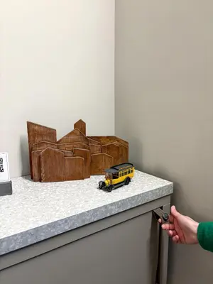 a toy yellow truck sitting on a counter top at The shelter in Rome