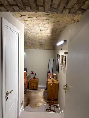 a hallway with a room with a wooden ceiling at The shelter in Rome