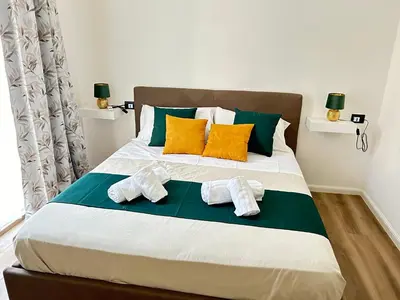 a bedroom with a bed with towels on it at House of Wonders in Rome