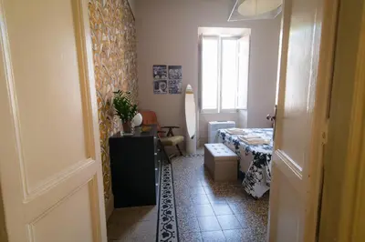 a small room with a bed and a window at Il Clivo in Rome