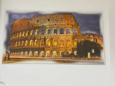 a picture of the colosseum at sunset at sweety rome in Rome