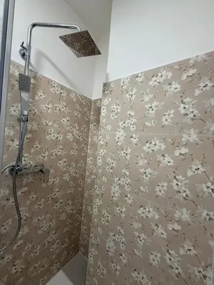 a shower with a shower head in a bathroom at sweety rome in Rome
