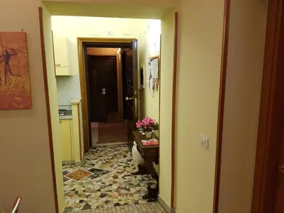 a hallway with a tile floor in a room at Alenic in Rome