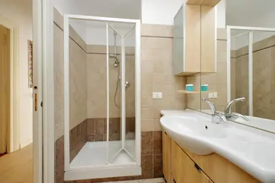 a bathroom with a shower and a sink at FM Apartment in Rome