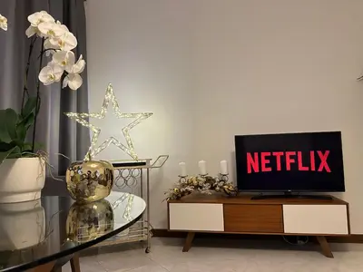 a living room with a tv sitting on a table at Stella Luxury House in Rome