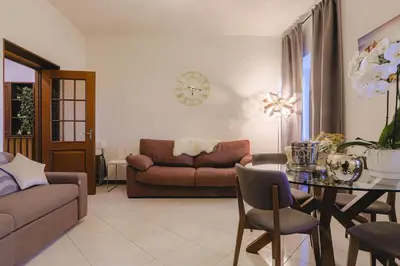 a living room with a couch and a table at Stella Luxury House in Rome